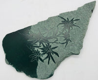 Etched Flowers On Green Stone